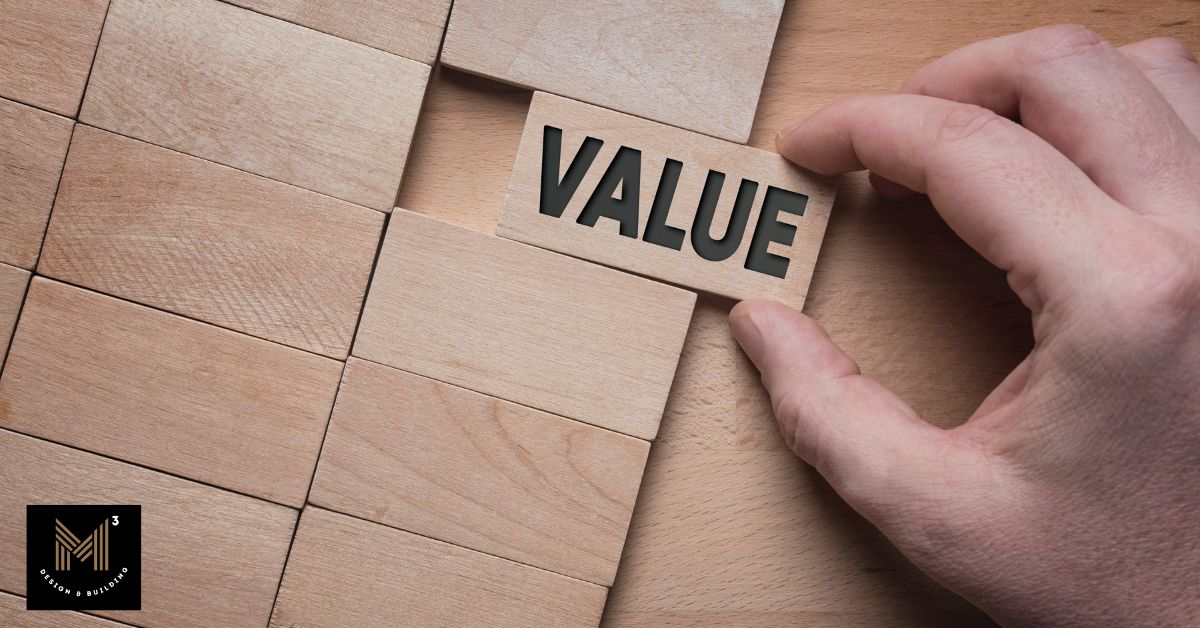 Close-up of a hand placing a wooden block labeled "VALUE" into a puzzle, symbolizing value engineering in construction through balancing performance, function, and project efficiency.