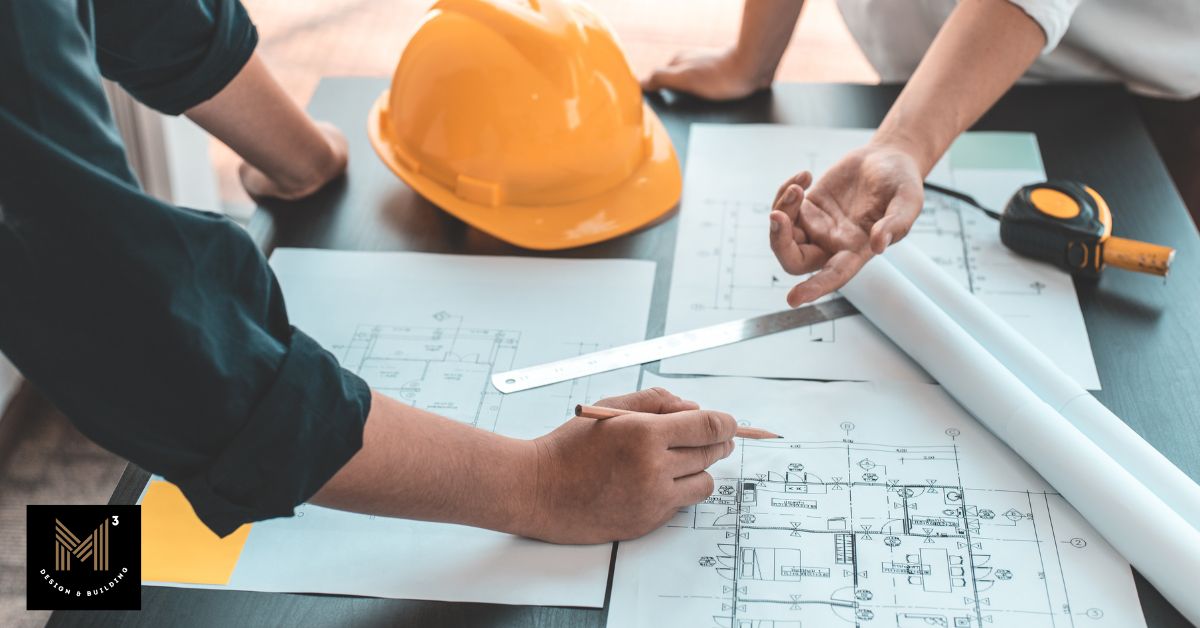 Architects, engineers, and construction professionals reviewing architectural plans together during a value engineering meeting, evaluating design alternatives before project decisions are finalized.